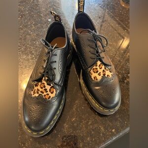 Dr. Martens black leather shoes with leopard print heart. (Joyce Heart).